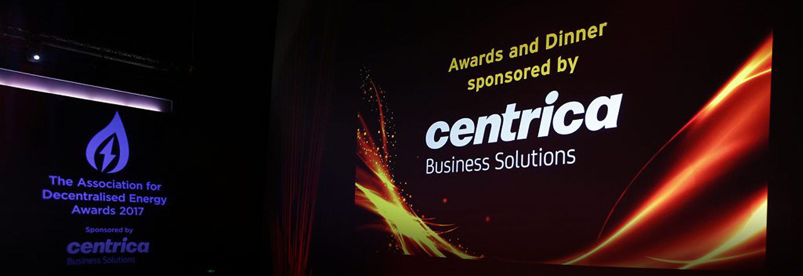 A screen displaying 'Awards and Dinner sponsored by Centrica Business Solutions' at Association for Decentralised Energy 50th Anniversary