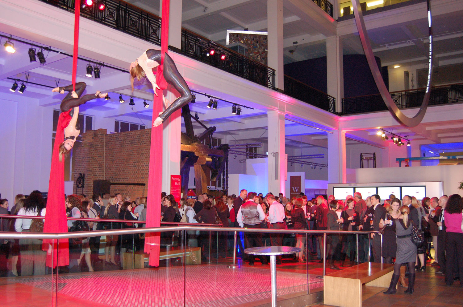 Aerial acrobats performing in the energy hall