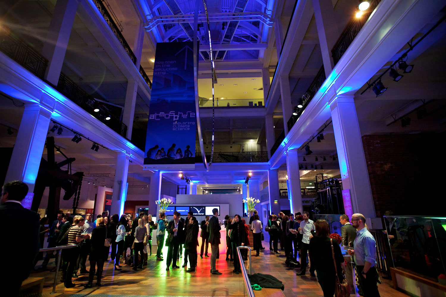Evening event guests mingle in the Energy Hall