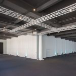 Empty event space with white walls